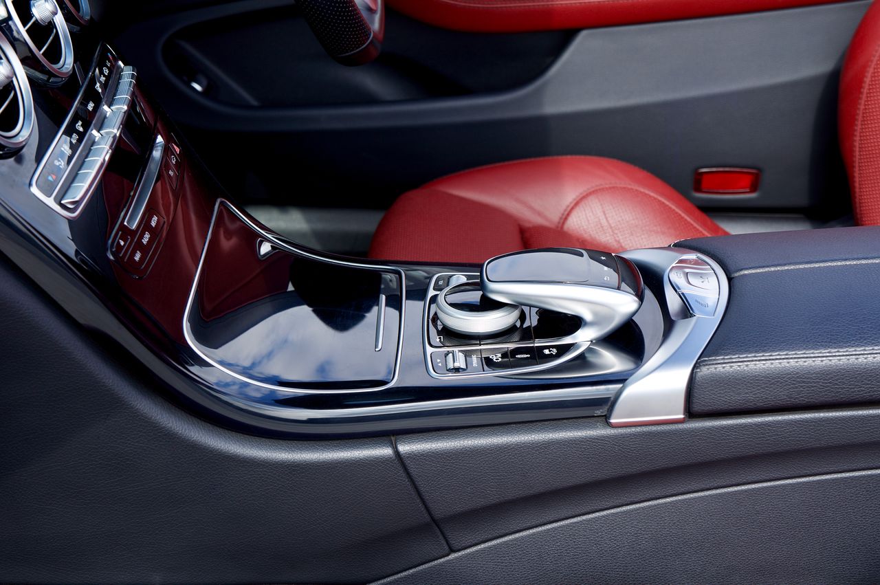 Close-up of a luxury car interior showcasing modern design elements and a sleek dashboard.